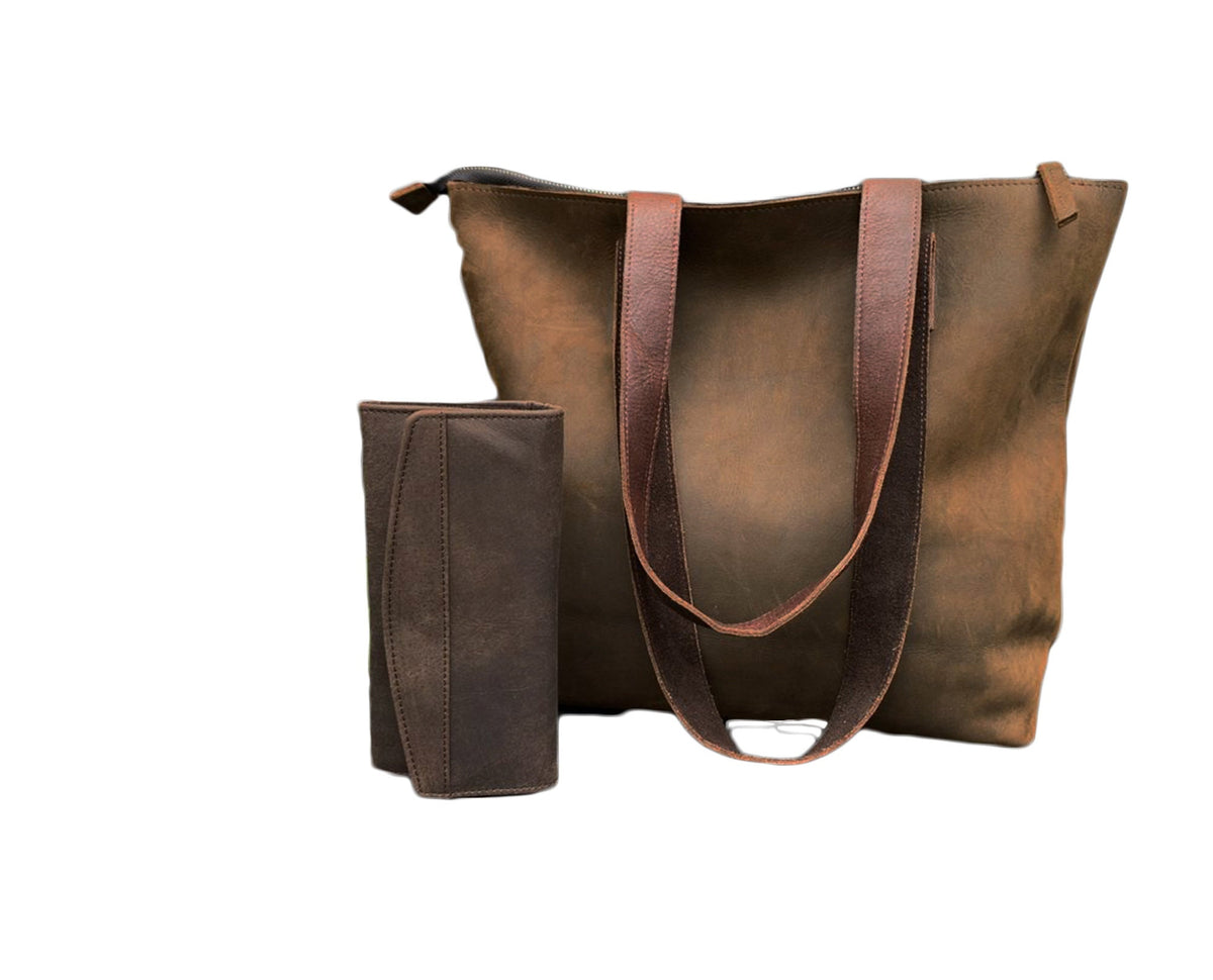 May include: A brown leather tote bag with brown leather straps and a matching brown leather wallet.
