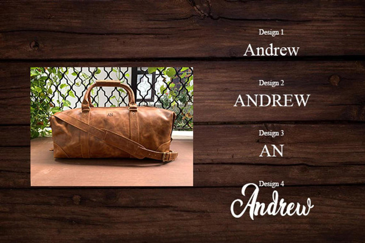 May include: A brown leather duffel bag with a strap and a monogrammed "AN" on the front. The bag is shown against a wood background with four different designs for the name "Andrew" in white text.