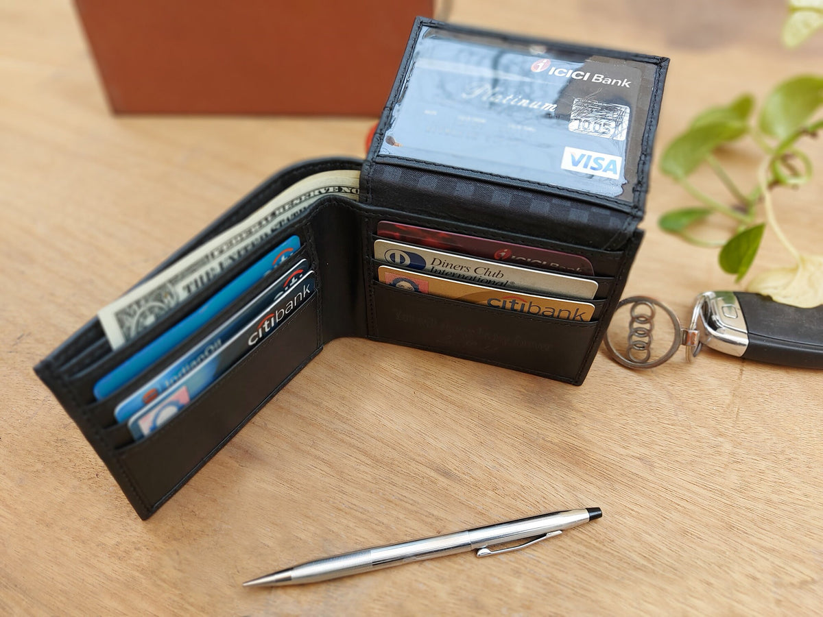 May include: A black leather wallet with multiple card slots and a bill compartment. The wallet is open and shows several credit cards and cash inside. The wallet also has a clear plastic window on the front with the text "ICICI Bank Platinum VISA" visible.