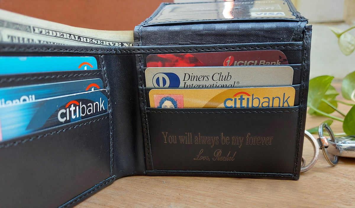 May include: A black leather wallet with multiple card slots and a personalized inscription that reads "You will always be my forever, Love, Rachel".
