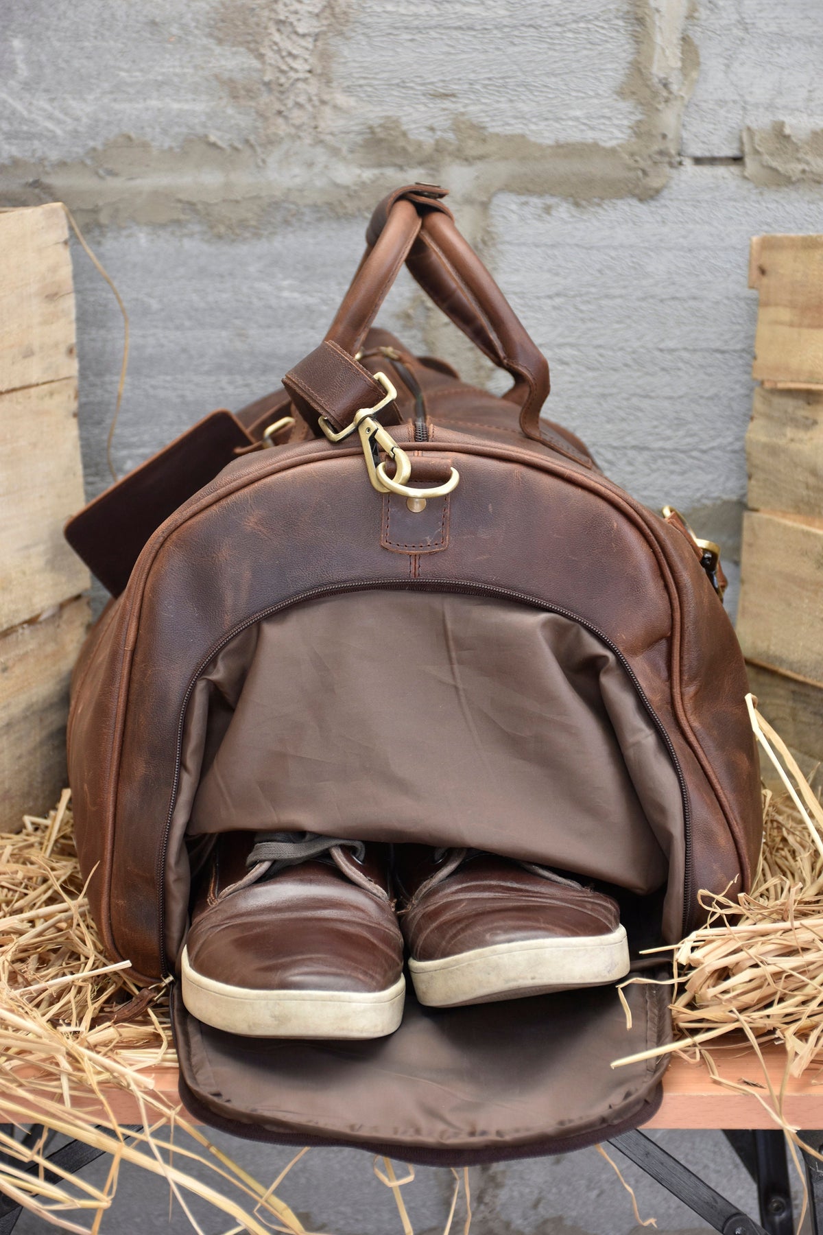 There are three interior pockets inside as well as a zipper pocket for quick access of essential items. The duffel bag is made from high quality full grain leather which is the most desirable leather.