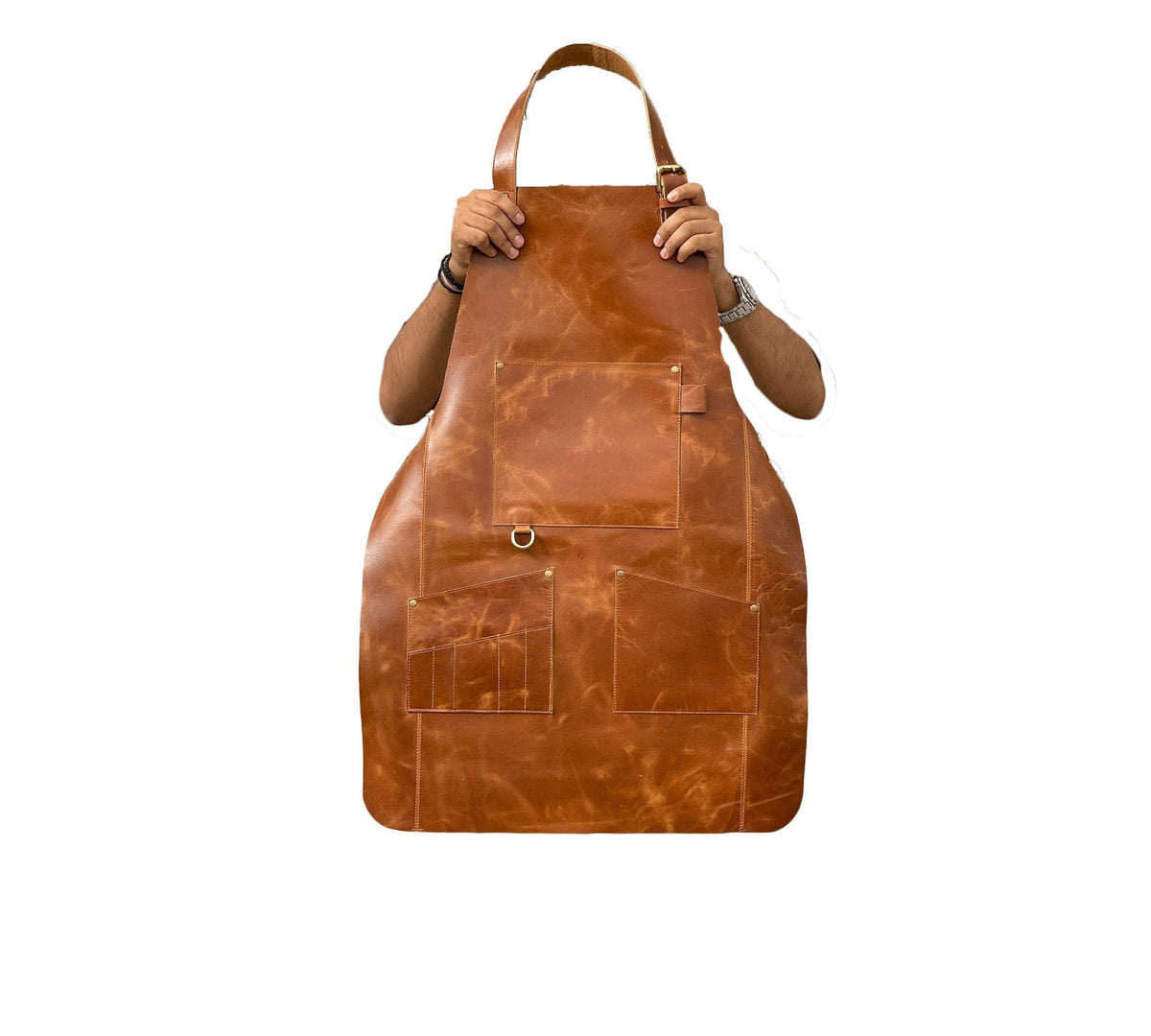 May include: A brown leather apron with multiple pockets and a brass ring.