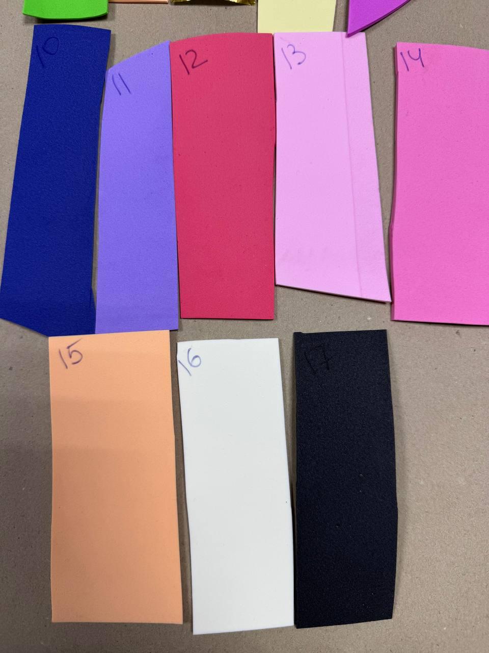 May include: A collection of 10 different colored fabric swatches, numbered 10 through 17. The swatches are arranged in two rows, with the top row containing swatches 10 through 14 and the bottom row containing swatches 15 through 17. The swatches are all rectangular in shape and are approximately 10 cm by 15 cm in size.
