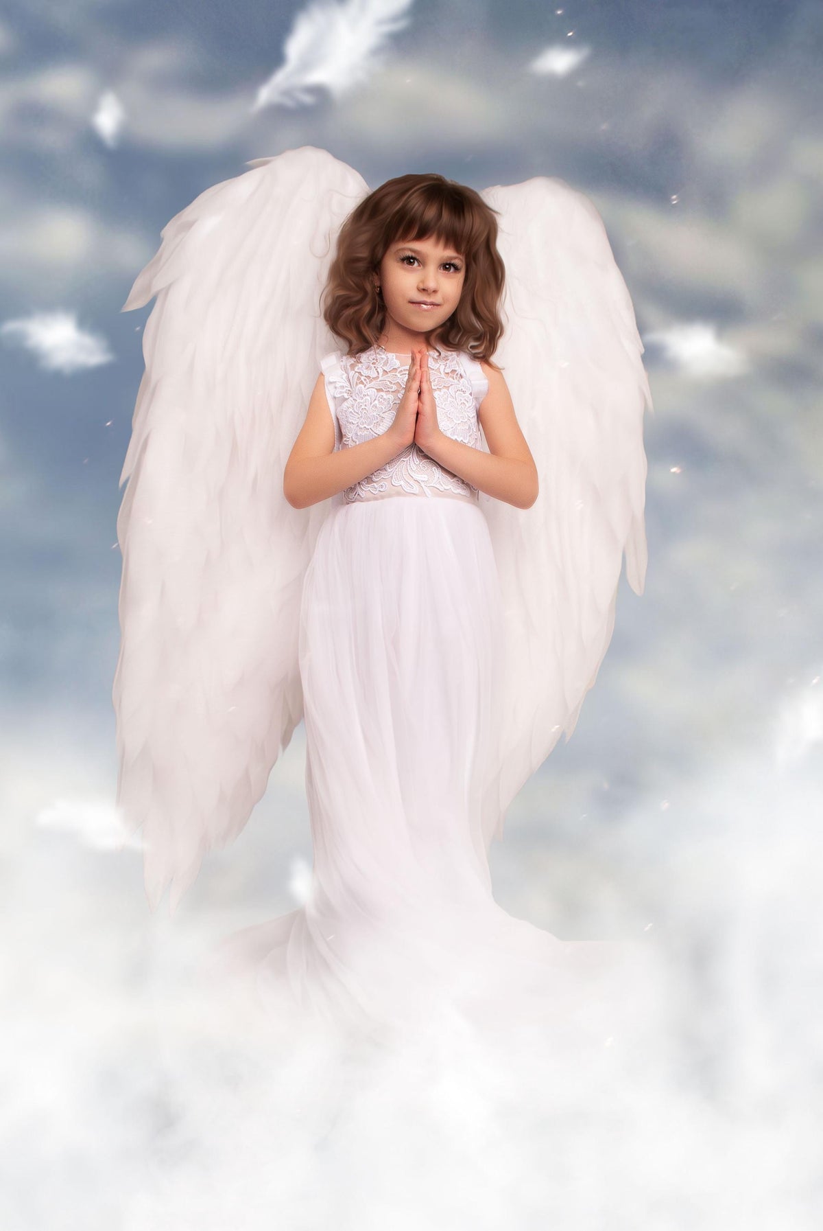 May include: A young girl dressed as an angel with white wings and a white dress, standing in front of a cloudy sky background.