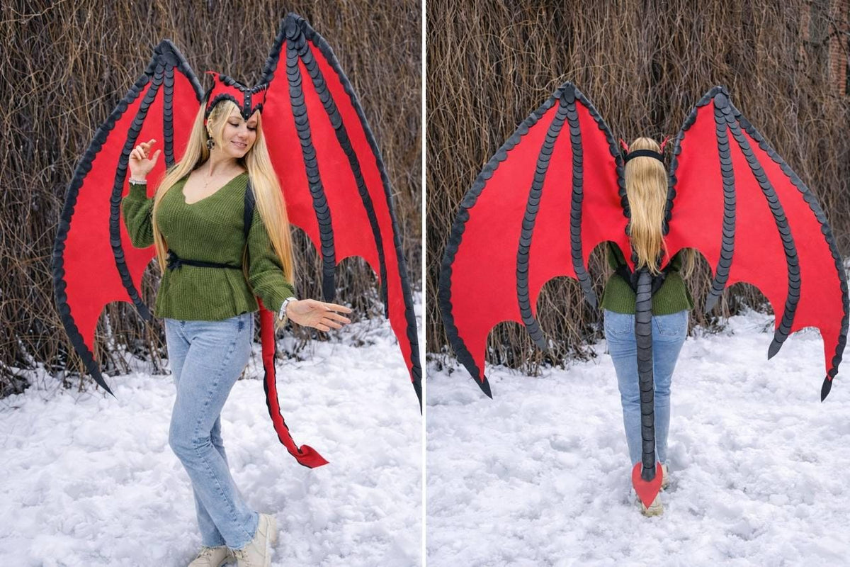 May include: Red and black dragon wings with a matching headpiece and tail. The wings are a vibrant red with black accents and a detailed design. The tail is long and red, and the headpiece is black and red. Perfect for cosplay or costume parties.